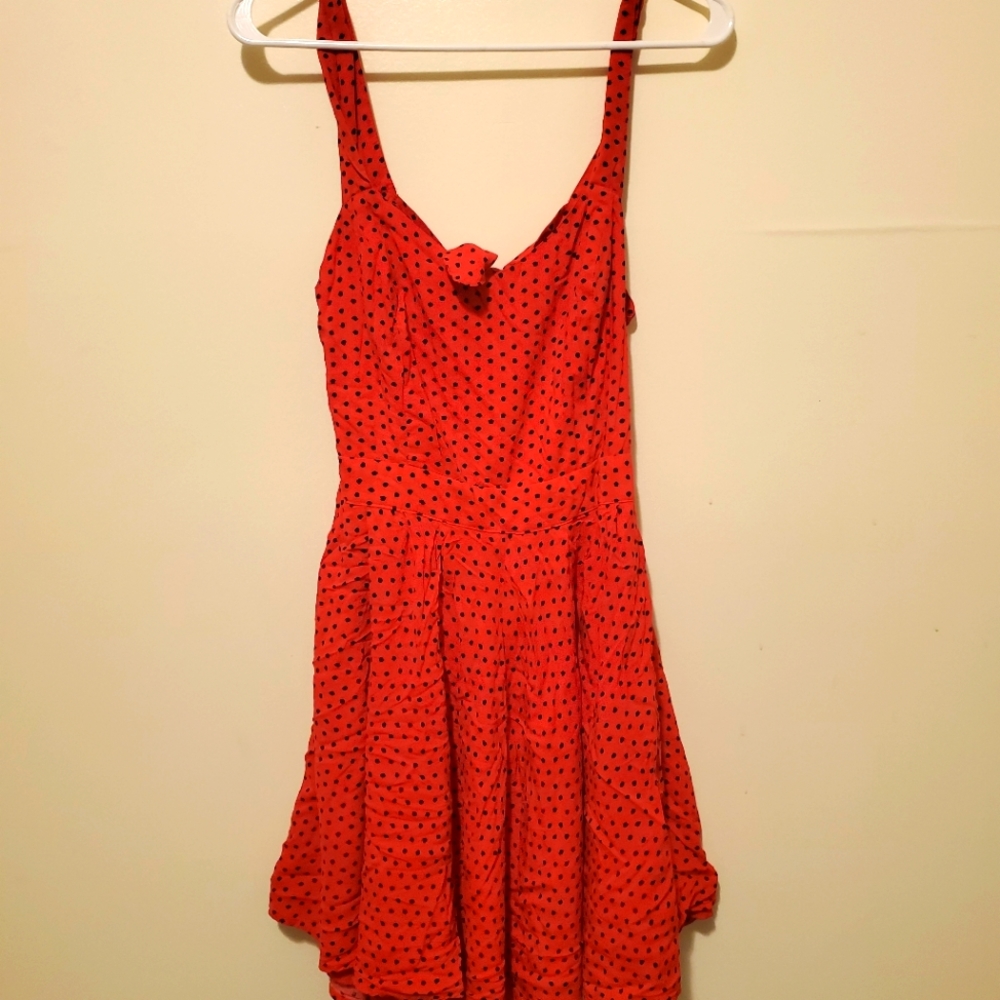 Red poka dot low back dress